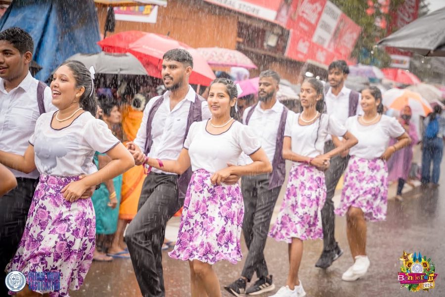 Dancers performing in the monsoon rain